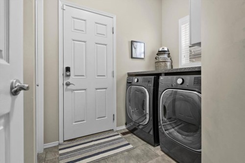 66 Tuscany Reserve Gate Nw, Calgary, AB - Indoor Photo Showing Laundry Room