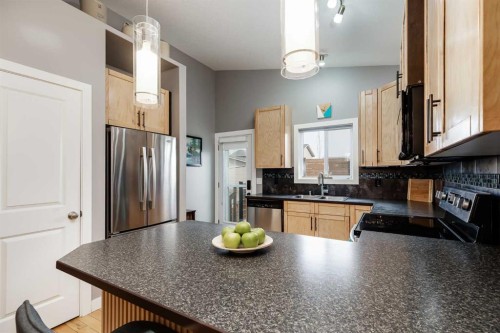 12 Mcclung Gate, Carstairs, AB - Indoor Photo Showing Kitchen With Double Sink