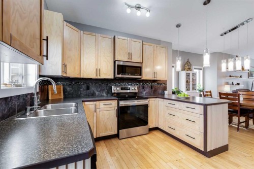 12 Mcclung Gate, Carstairs, AB - Indoor Photo Showing Kitchen With Double Sink