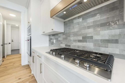 495 Rivercrest View, Cochrane, AB - Indoor Photo Showing Kitchen With Upgraded Kitchen