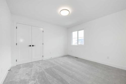 495 Rivercrest View, Cochrane, AB - Indoor Photo Showing Other Room