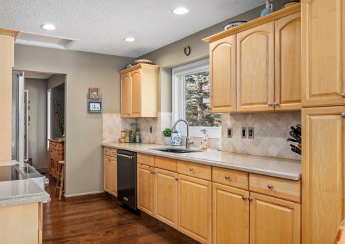 94 Sunset Way, Priddis Greens, AB - Indoor Photo Showing Kitchen With Double Sink