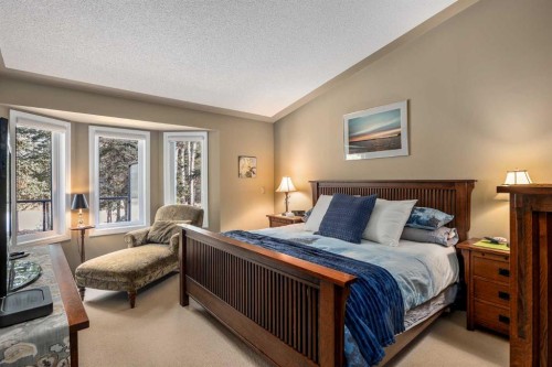 94 Sunset Way, Priddis Greens, AB - Indoor Photo Showing Bedroom