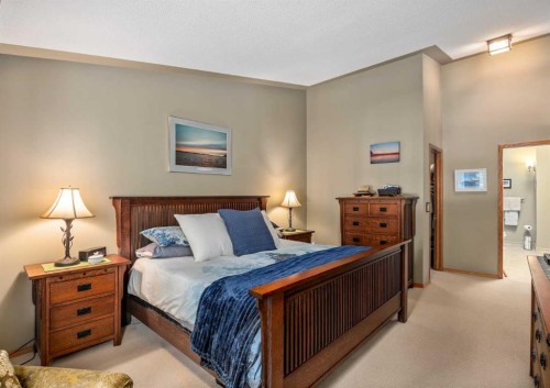 94 Sunset Way, Priddis Greens, AB - Indoor Photo Showing Bedroom