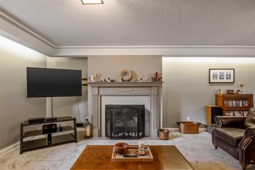 94 Sunset Way, Priddis Greens, AB - Indoor Photo Showing Living Room