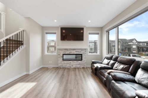 7 Corner Glen Common Ne, Calgary, AB - Indoor Photo Showing Living Room With Fireplace