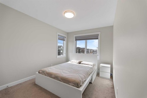7 Corner Glen Common Ne, Calgary, AB - Indoor Photo Showing Bedroom