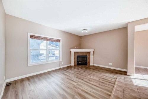 36 Saddleland Court Ne, Calgary, AB - Indoor Photo Showing Living Room With Fireplace