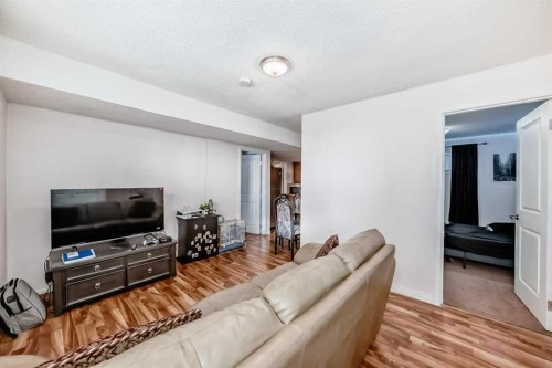 36 Saddleland Court Ne, Calgary, AB - Indoor Photo Showing Living Room
