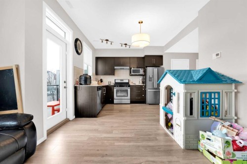 202-135 Redstone Walk Ne, Calgary, AB - Indoor Photo Showing Kitchen With Stainless Steel Kitchen
