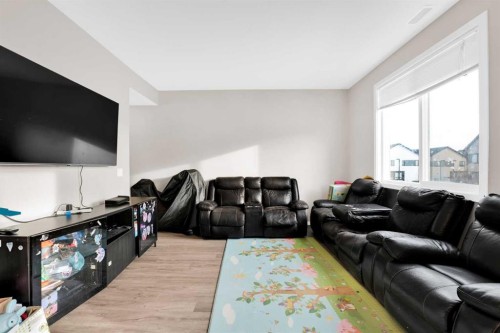 202-135 Redstone Walk Ne, Calgary, AB - Indoor Photo Showing Living Room