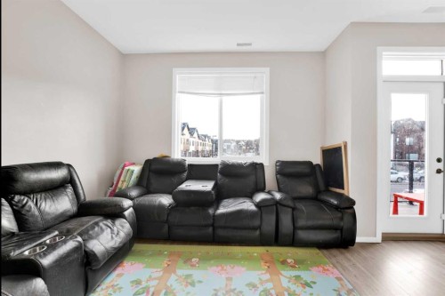 202-135 Redstone Walk Ne, Calgary, AB - Indoor Photo Showing Living Room