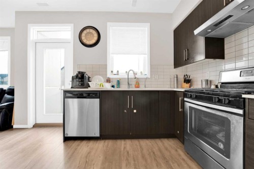 202-135 Redstone Walk Ne, Calgary, AB - Indoor Photo Showing Kitchen With Stainless Steel Kitchen With Upgraded Kitchen