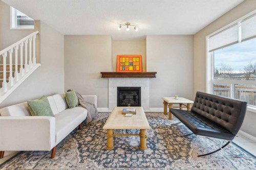 71 Walden Manor Se, Calgary, AB - Indoor Photo Showing Living Room With Fireplace