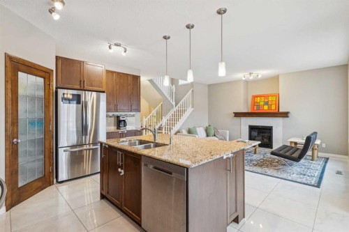 71 Walden Manor Se, Calgary, AB - Indoor Photo Showing Kitchen With Fireplace With Stainless Steel Kitchen With Double Sink With Upgraded Kitchen