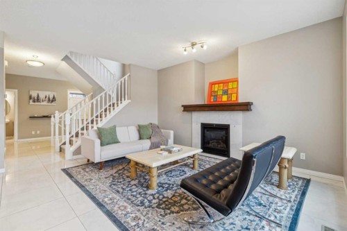 71 Walden Manor Se, Calgary, AB - Indoor Photo Showing Living Room With Fireplace