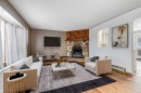 41 Alpine Crescent Se, Airdrie, AB  - Indoor Photo Showing Living Room With Fireplace 