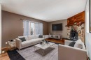 41 Alpine Crescent Se, Airdrie, AB  - Indoor Photo Showing Living Room With Fireplace 