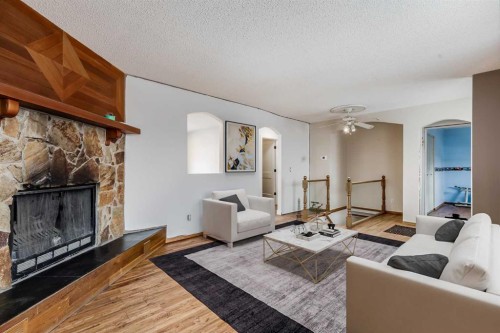41 Alpine Crescent Se, Airdrie, AB - Indoor Photo Showing Living Room With Fireplace