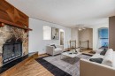41 Alpine Crescent Se, Airdrie, AB  - Indoor Photo Showing Living Room With Fireplace 