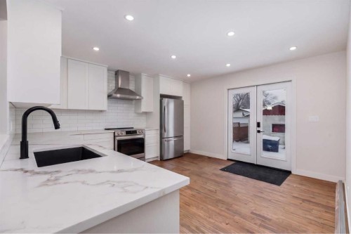 41 Alpine Crescent Se, Airdrie, AB - Indoor Photo Showing Kitchen With Stainless Steel Kitchen With Upgraded Kitchen