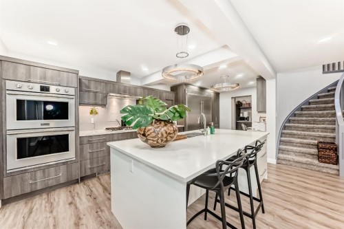 22 Coach Manor Terrace Sw, Calgary, AB - Indoor Photo Showing Kitchen With Upgraded Kitchen