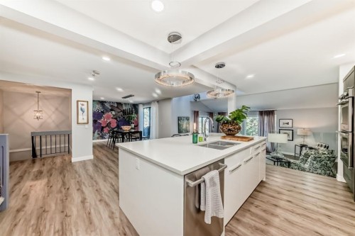 22 Coach Manor Terrace Sw, Calgary, AB - Indoor Photo Showing Kitchen With Double Sink