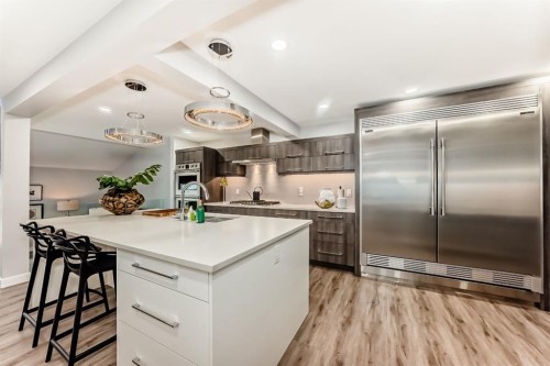 22 Coach Manor Terrace Sw, Calgary, AB - Indoor Photo Showing Kitchen With Upgraded Kitchen