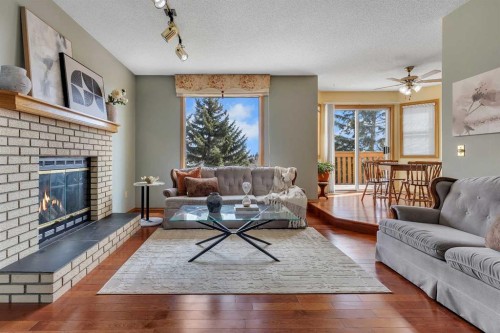 2856 Signal Hill Heights Sw, Calgary, AB - Indoor Photo Showing Living Room With Fireplace