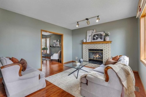 2856 Signal Hill Heights Sw, Calgary, AB - Indoor Photo Showing Living Room With Fireplace