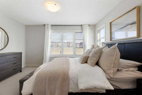 88 Copperpond Park Se, Calgary, AB - Indoor Photo Showing Bedroom
