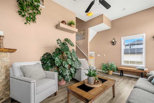 53 Copperfield Court Se, Calgary, AB - Indoor Photo Showing Living Room With Fireplace