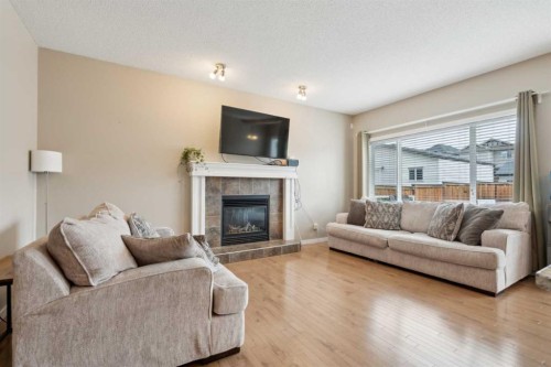 22 Nolanfield Heights Nw, Calgary, AB - Indoor Photo Showing Living Room With Fireplace