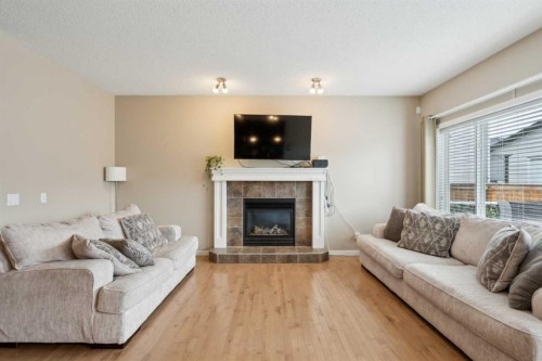 22 Nolanfield Heights Nw, Calgary, AB - Indoor Photo Showing Living Room With Fireplace