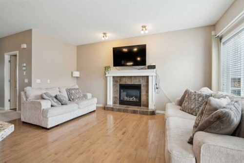 22 Nolanfield Heights Nw, Calgary, AB - Indoor Photo Showing Living Room With Fireplace