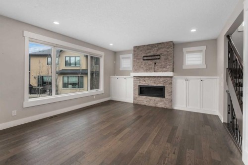 45 Rockcliff Heights Nw, Calgary, AB - Indoor Photo Showing Living Room With Fireplace