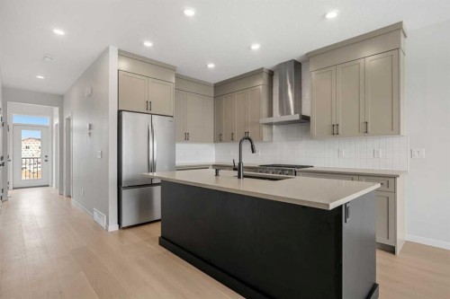 213 Bridgeport Gate, Chestermere, AB - Indoor Photo Showing Kitchen With Upgraded Kitchen