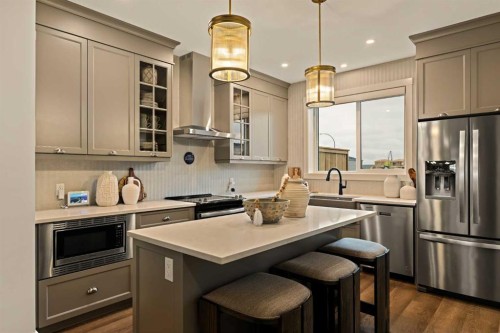 193 Silver Spruce Road Sw, Calgary, AB - Indoor Photo Showing Kitchen With Upgraded Kitchen