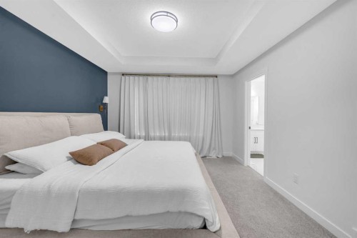 11 Heritage Circle, Cochrane, AB - Indoor Photo Showing Bedroom
