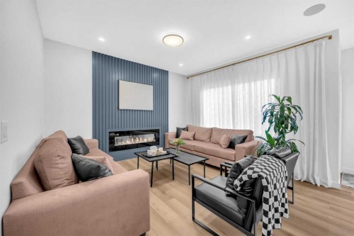 11 Heritage Circle, Cochrane, AB - Indoor Photo Showing Living Room With Fireplace