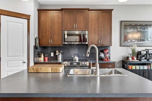 72 Auburn Bay Avenue Se, Calgary, AB - Indoor Photo Showing Kitchen With Double Sink