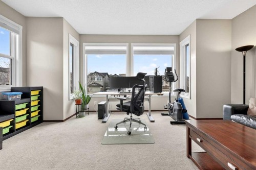 72 Auburn Bay Avenue Se, Calgary, AB - Indoor Photo Showing Gym Room