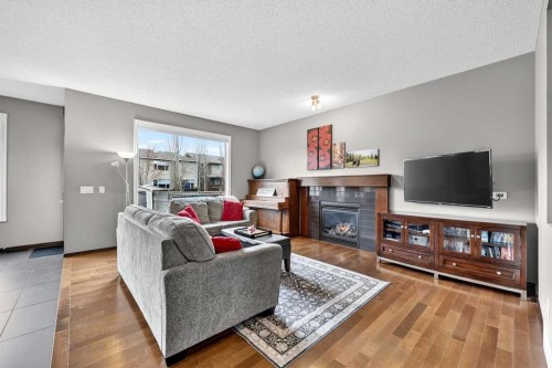 72 Auburn Bay Avenue Se, Calgary, AB - Indoor Photo Showing Living Room With Fireplace