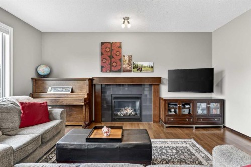 72 Auburn Bay Avenue Se, Calgary, AB - Indoor Photo Showing Living Room With Fireplace