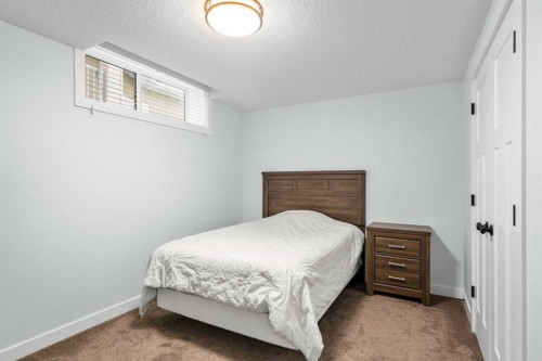 99 Ridge View Close, Cochrane, AB - Indoor Photo Showing Bedroom