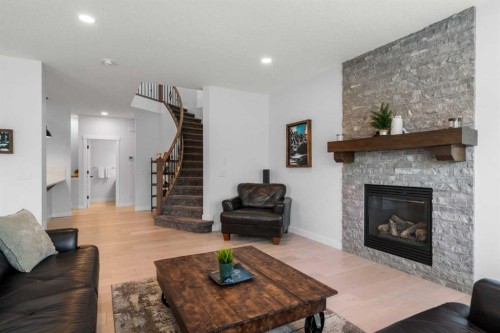 99 Ridge View Close, Cochrane, AB - Indoor Photo Showing Living Room With Fireplace