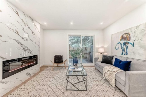 29-2519 38 Street Ne, Calgary, AB - Indoor Photo Showing Living Room With Fireplace