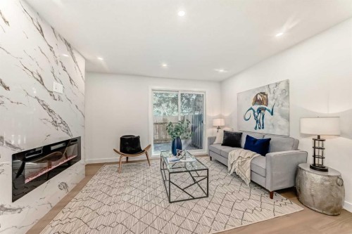 29-2519 38 Street Ne, Calgary, AB - Indoor Photo Showing Living Room With Fireplace