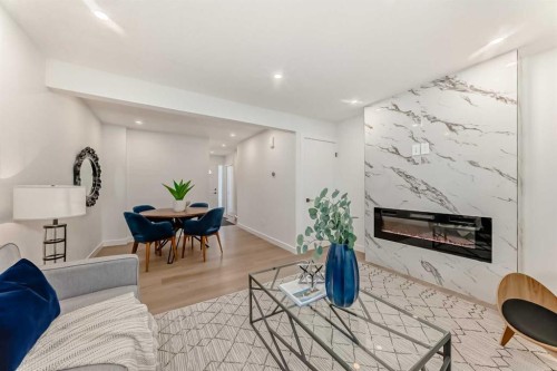 29-2519 38 Street Ne, Calgary, AB - Indoor Photo Showing Living Room With Fireplace