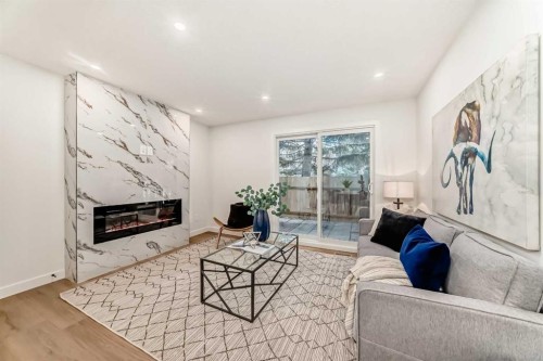 29-2519 38 Street Ne, Calgary, AB - Indoor Photo Showing Living Room With Fireplace